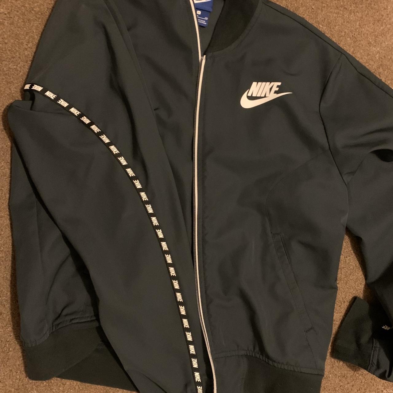 Nike wind jacket with detailed sleeves (bomber... - Depop
