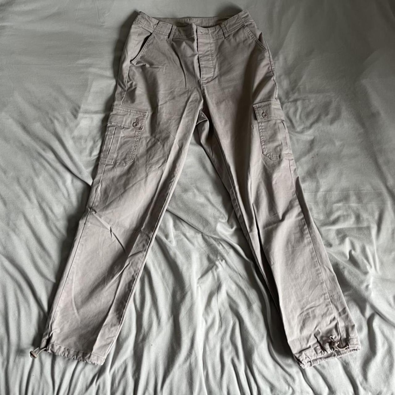 beige cargo trousers with a adjustable cuffed leg... Depop