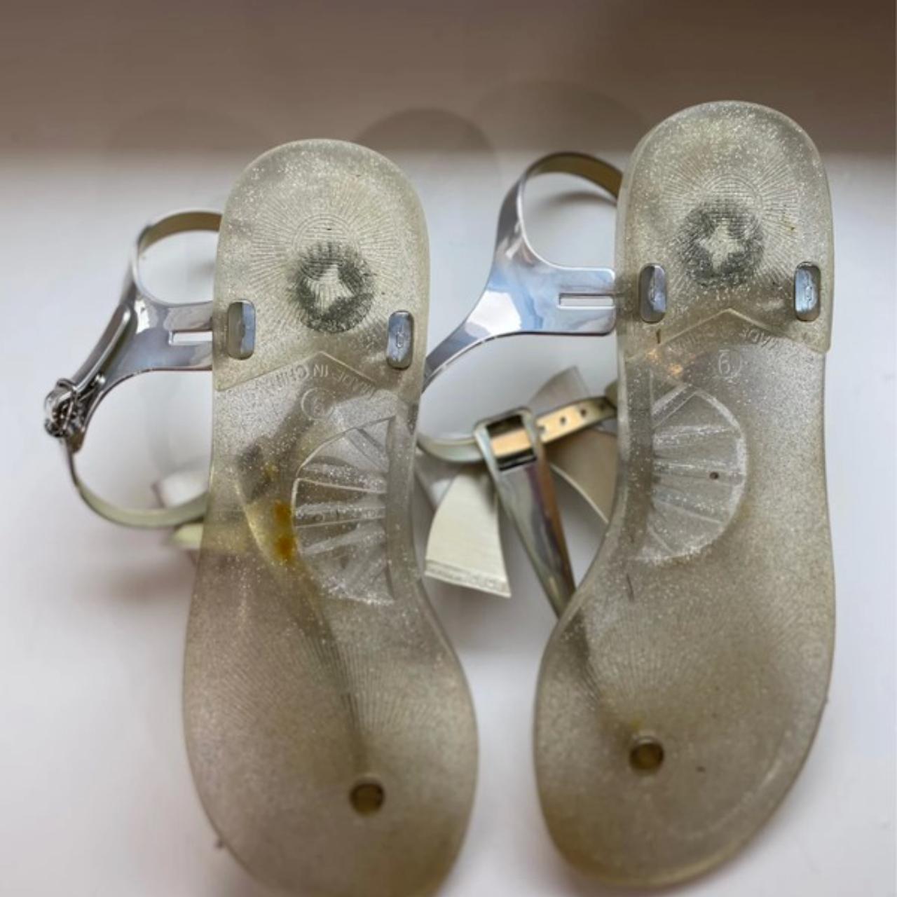 Silver and clears jelly sandals with bow. BCBG