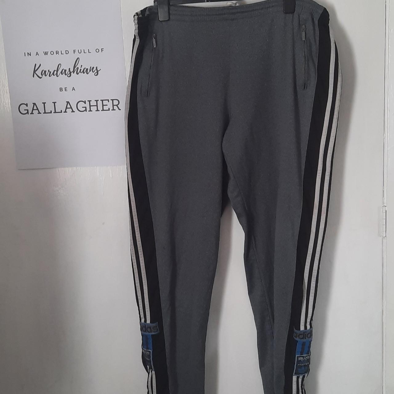 Adidas originals joggers with hotsell poppers black