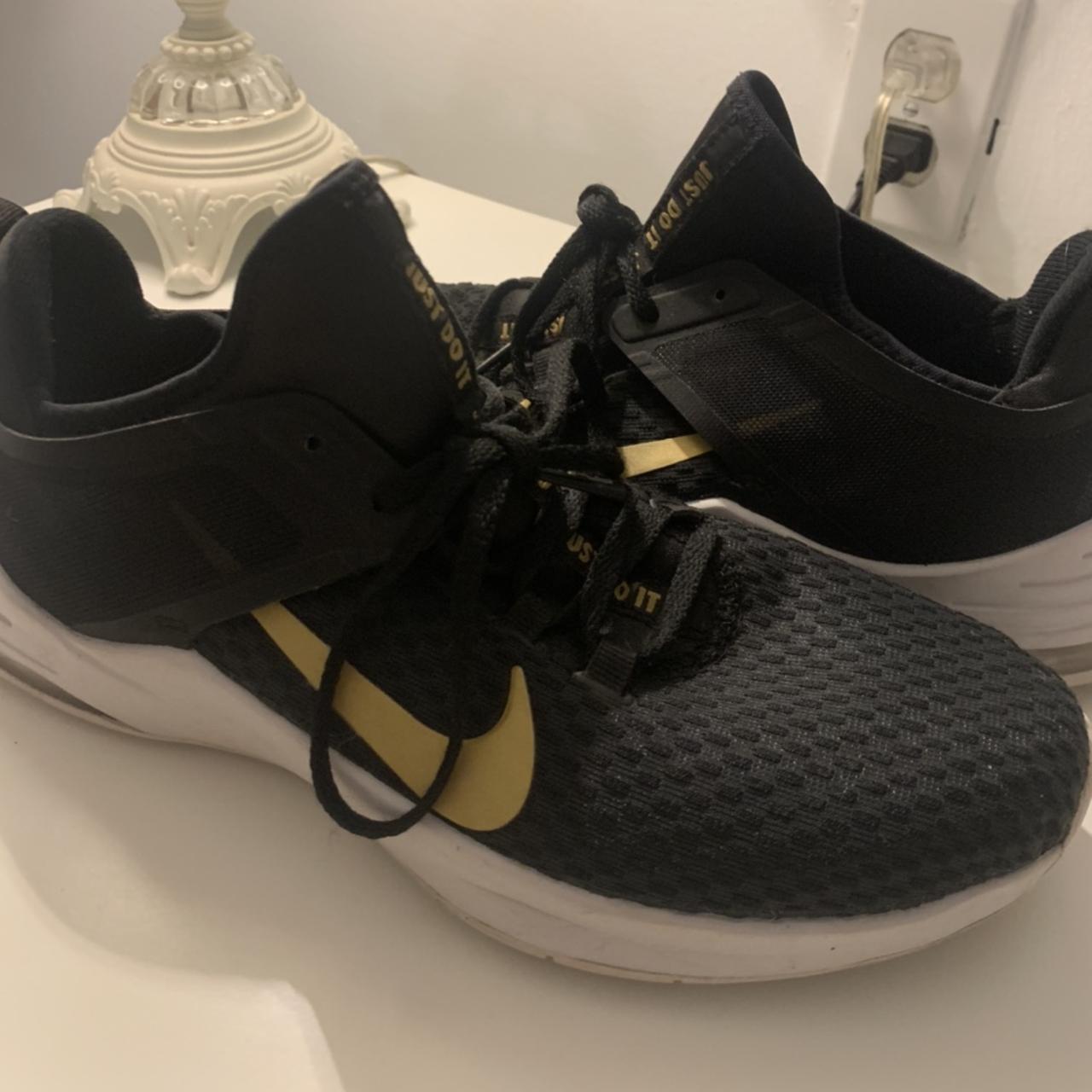 Ladies black and gold hotsell nike trainers