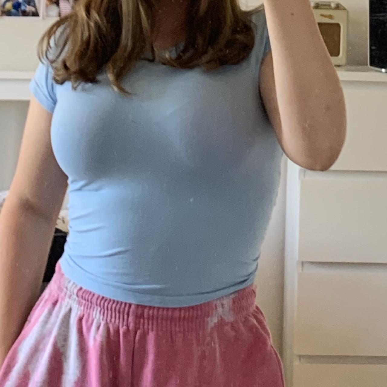 light blue baby tee in perf condition apart from a... - Depop