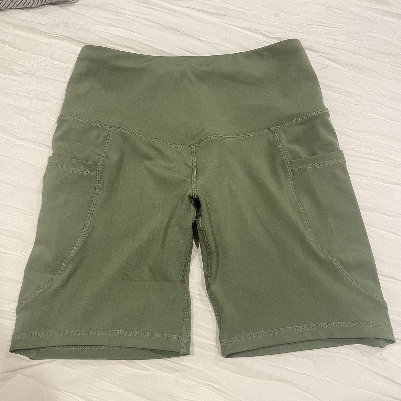 nyl workout shorts with pockets olive green size... - Depop