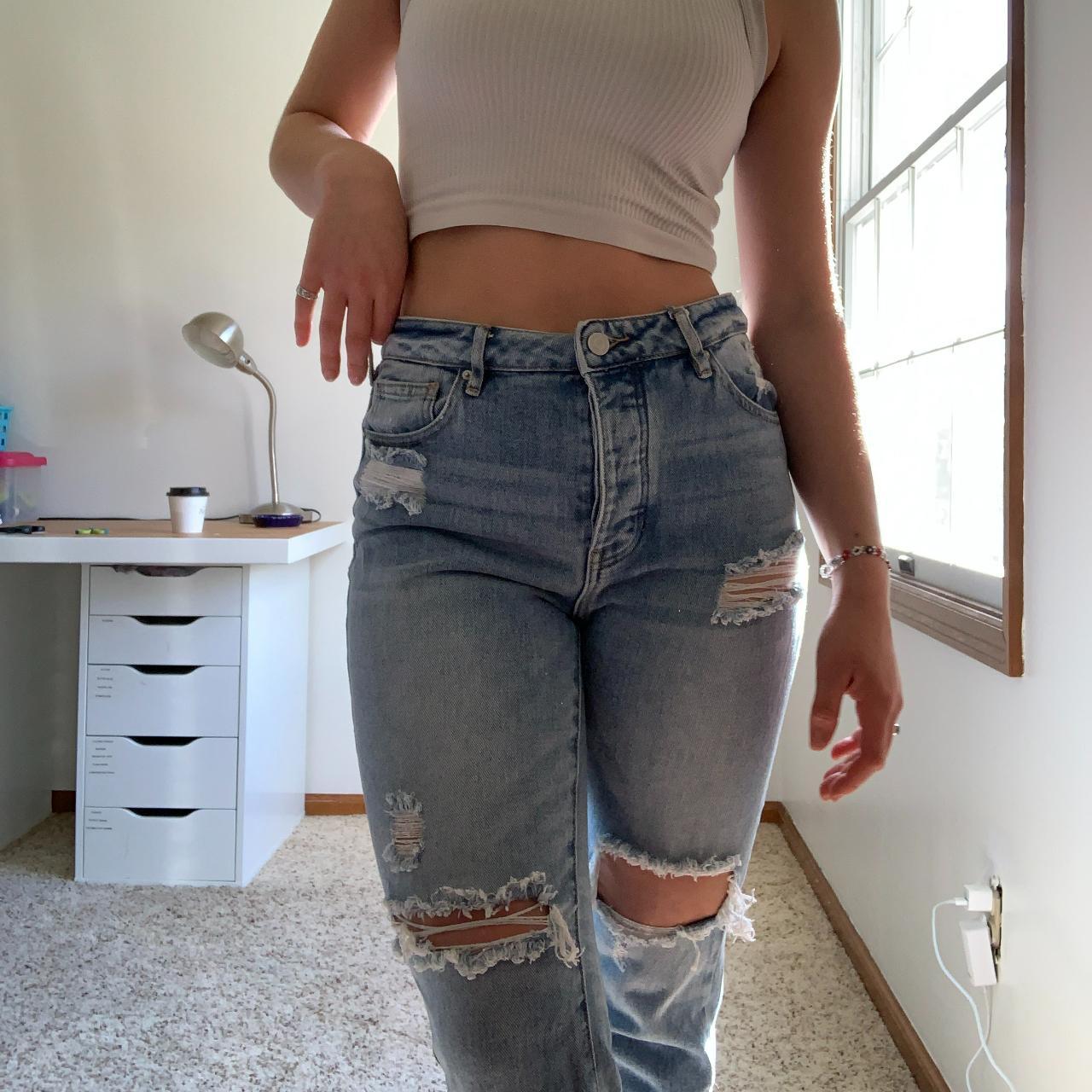 Light wash ripped mom jeans. High/medium rise fit.... - Depop