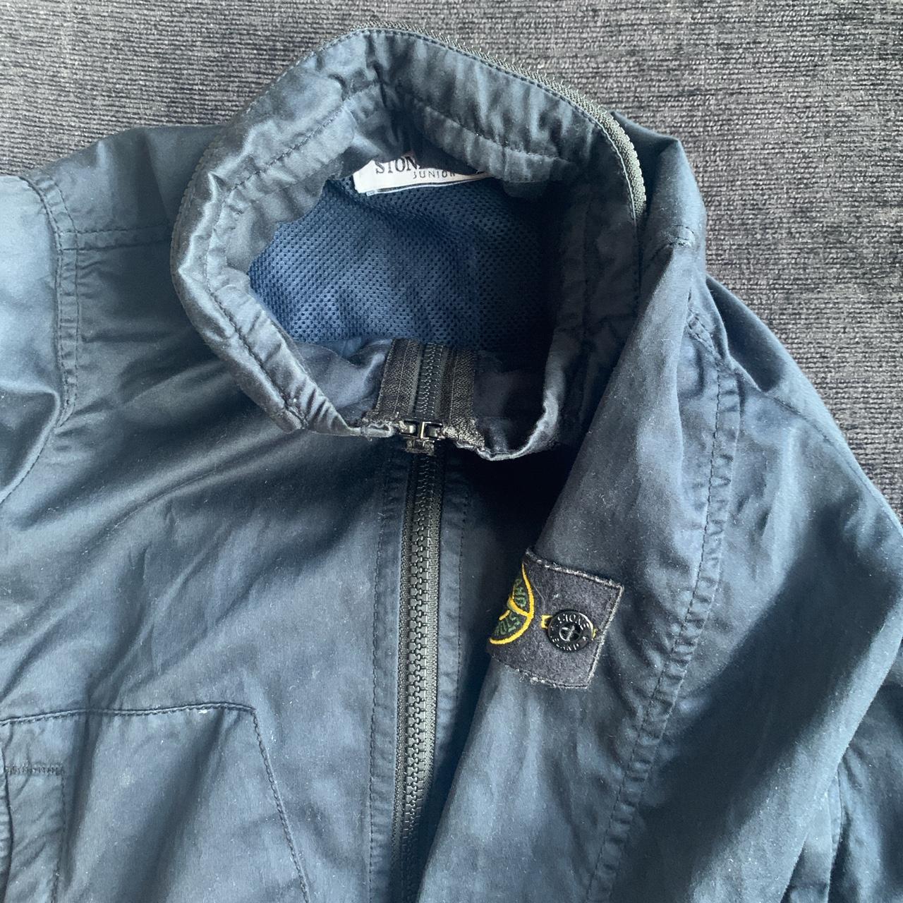 Stone island boys jacket with a zipped tucked away... - Depop