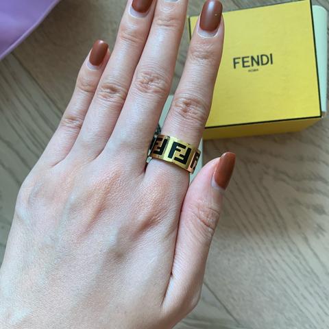 Fendi ring on deals hand