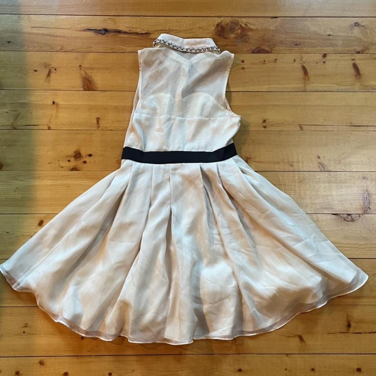 Incredible offwhite/cream dress with black bow and... Depop