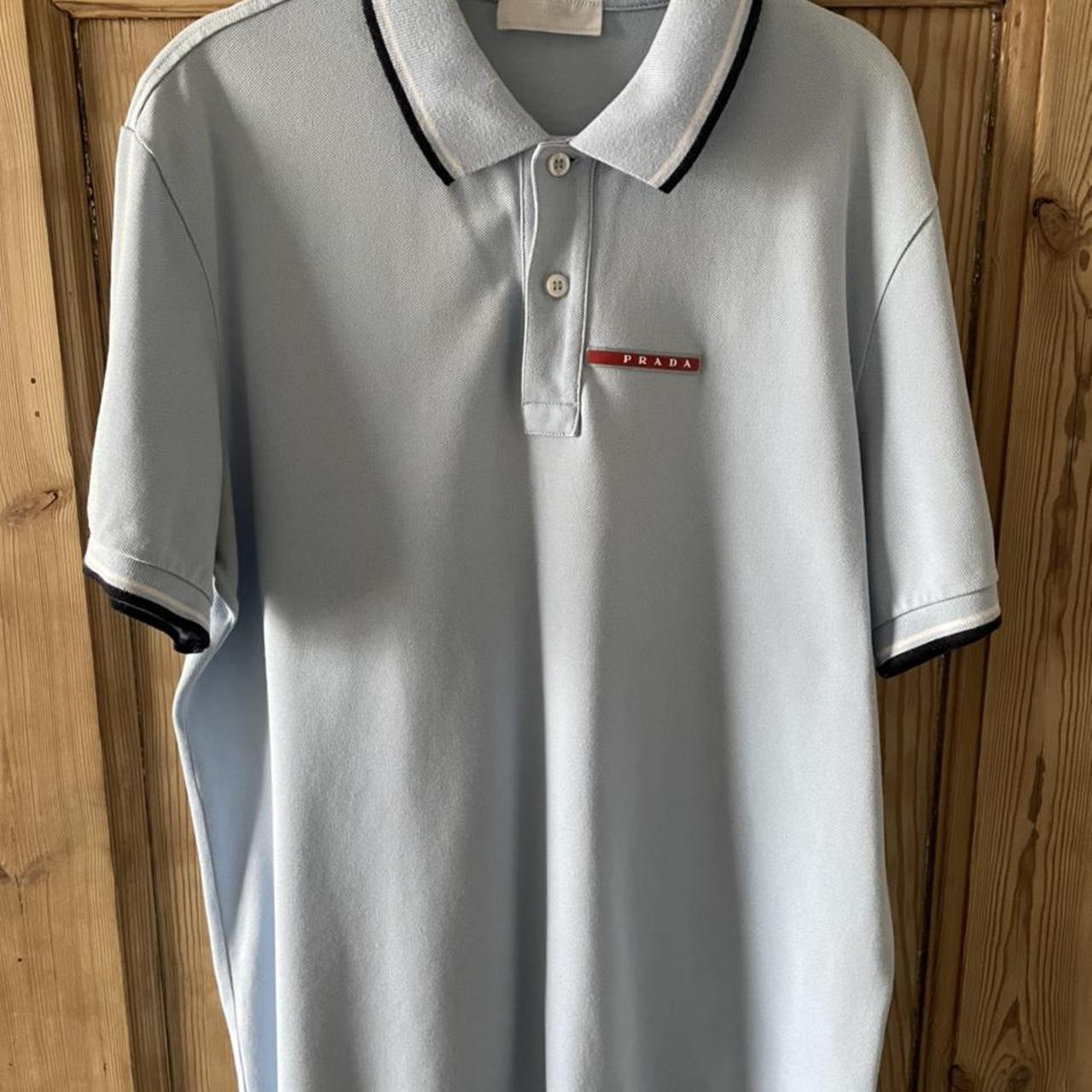 Large light blue prada polo open to offer Depop