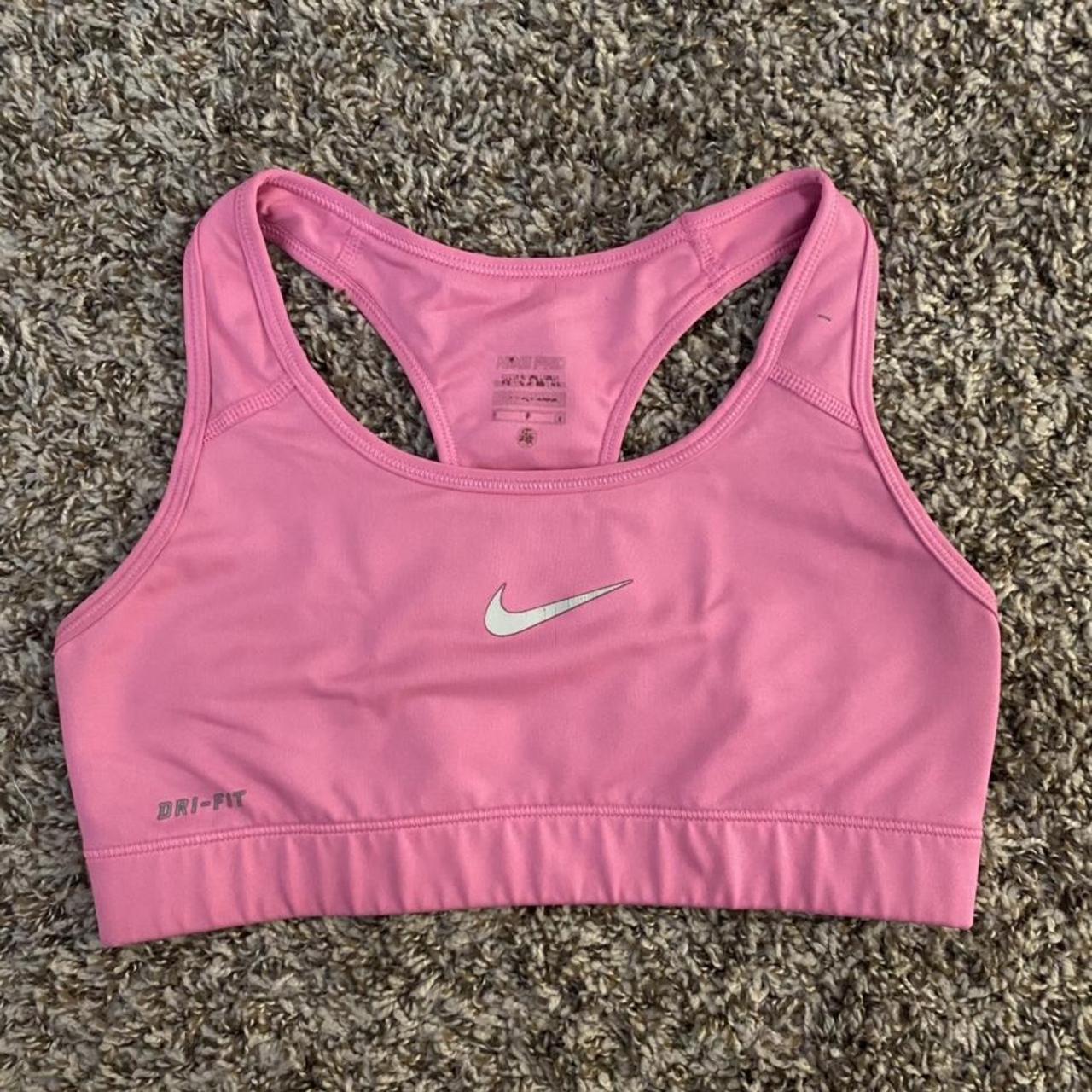 Pink Nike sports bra used but in great condition, - Depop