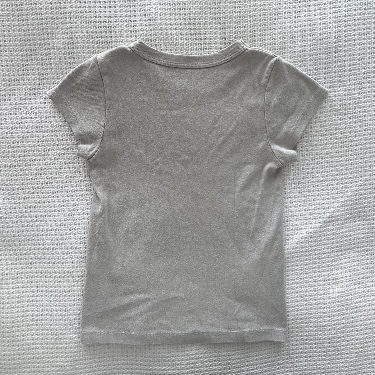 the cutest brandy baby tee! this top is a greyish... Depop