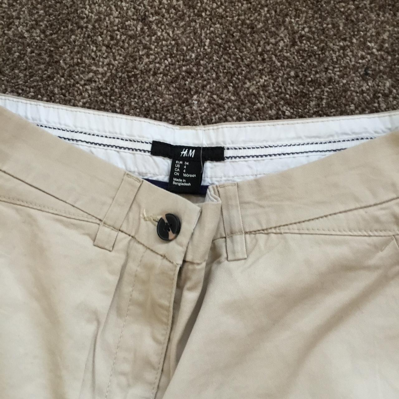 H&M beige chino trousers, size 34, would fit a size... - Depop