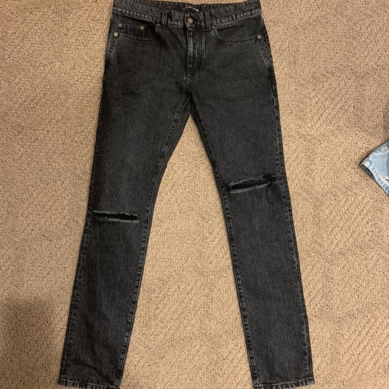 Saint laurent hotsell ripped knee jeans