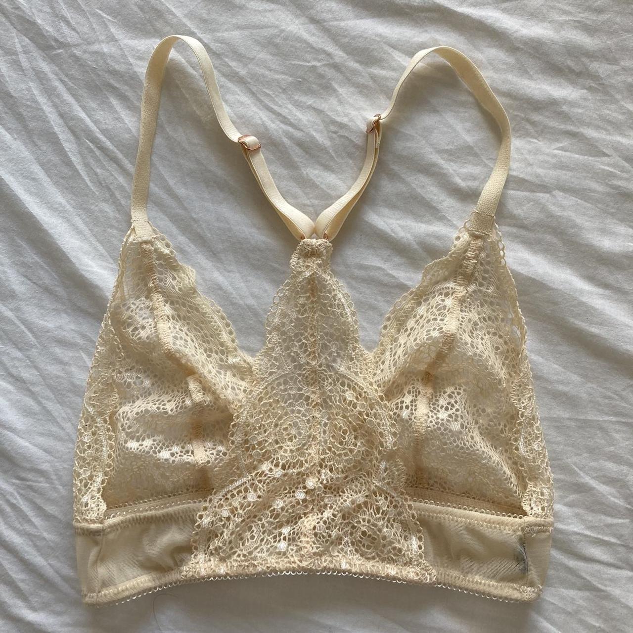 Cream and gold lace bra with cross back strap. Sheer... Depop