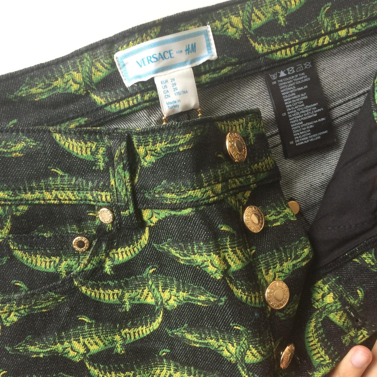 Versace for H&M jeans with crocodile print. Comes...