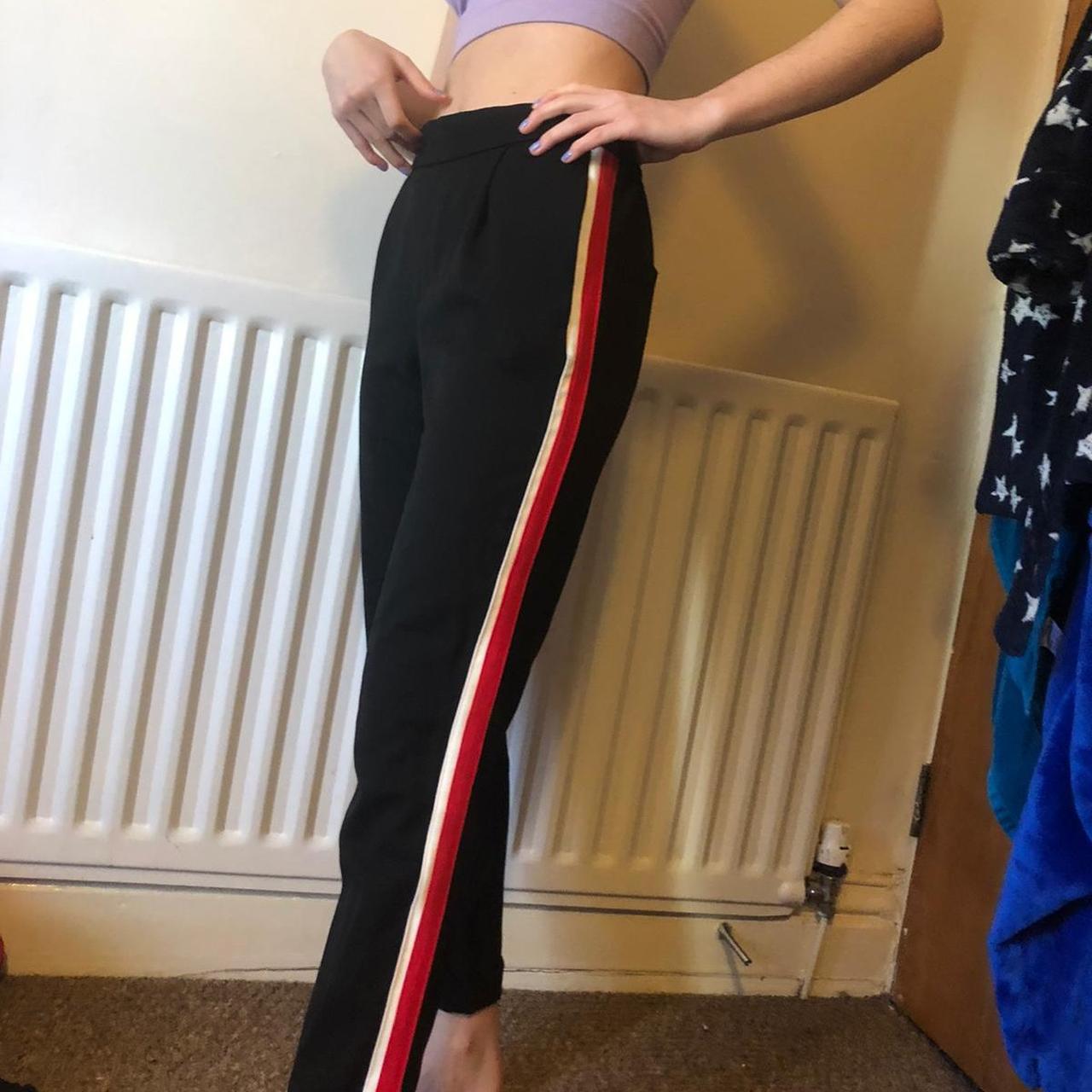 Black trousers with red 2024 stripe