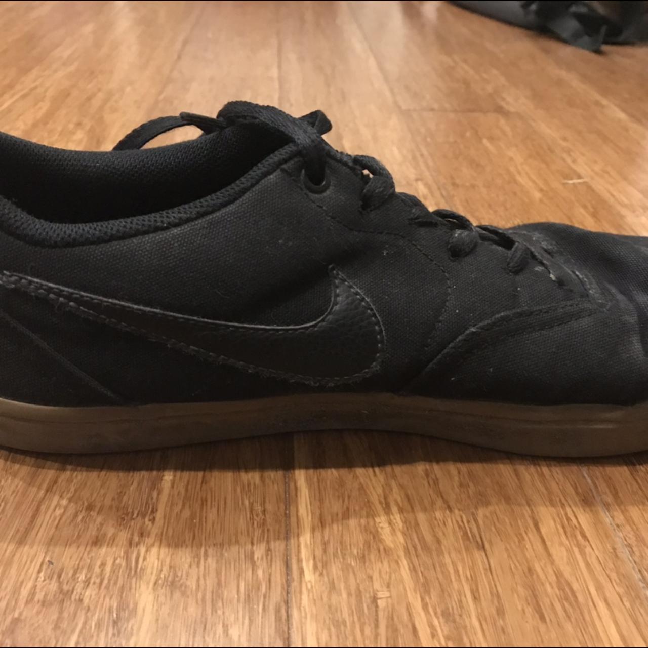 tan and black nike