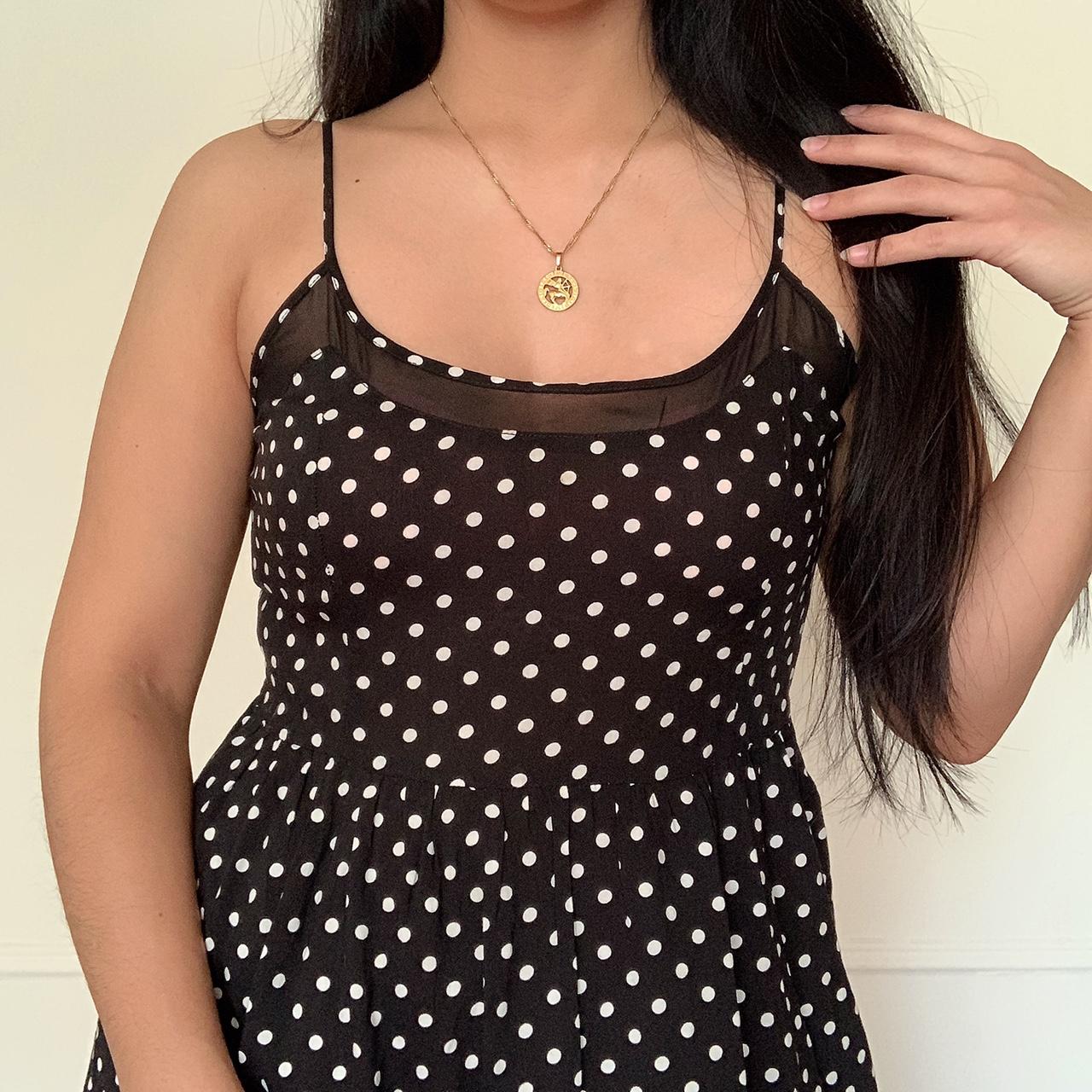 Strappy black polka dot mini dress. Straps are... Depop