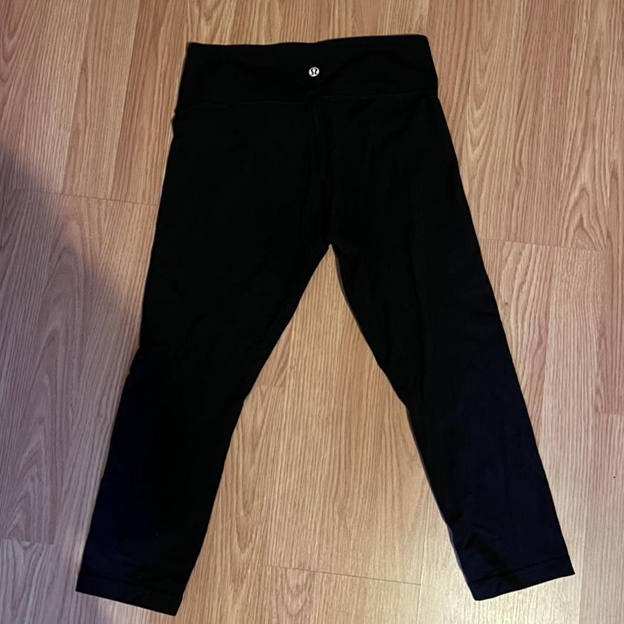 black low-rise lululemon short cut leggings, length