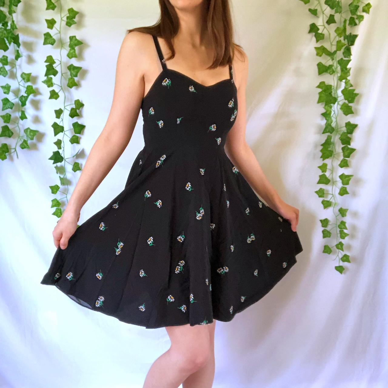 Black A line cami dress with daisy pattern From. Depop