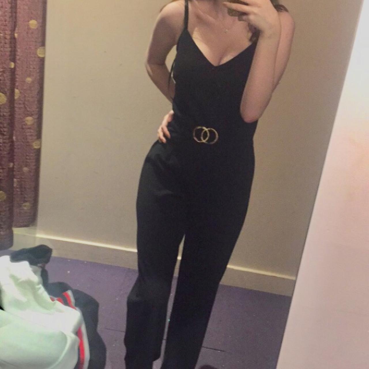 black jumpsuit with gold belt, super flattering!... - Depop