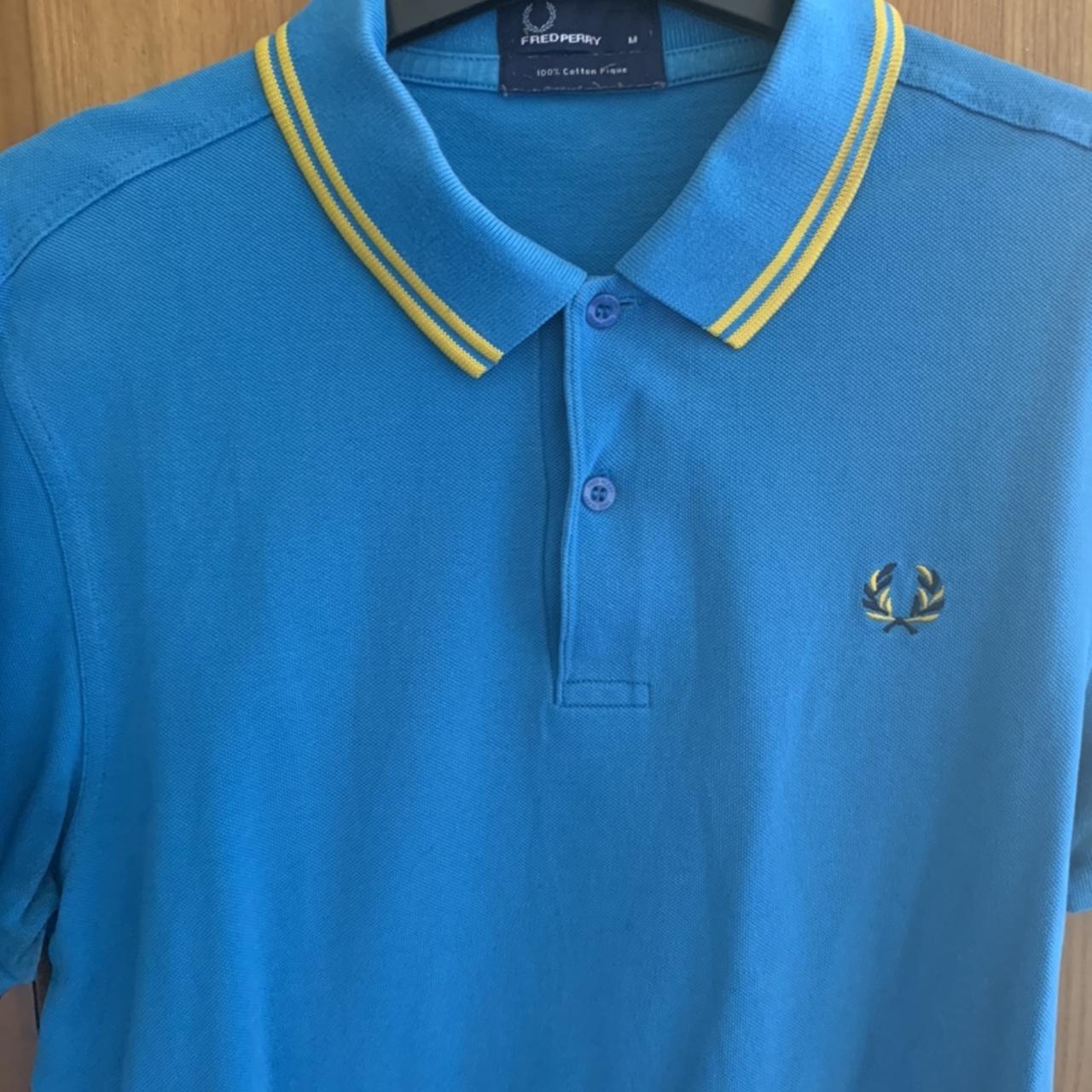 Vintage Fred Perry polo shirt. In blue with yellow... - Depop