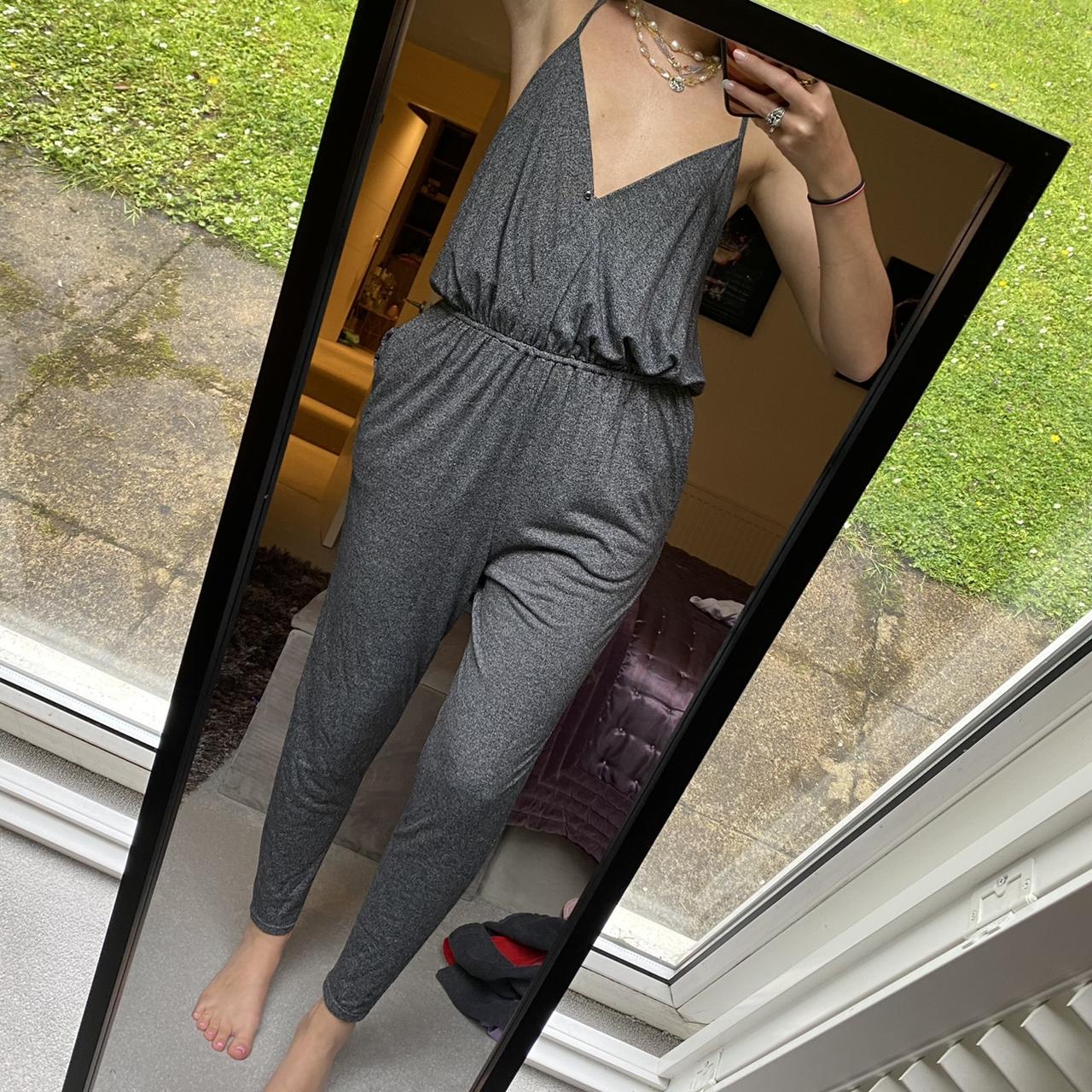 Gorgeous urban outfitters grey jumpsuit with low v... - Depop