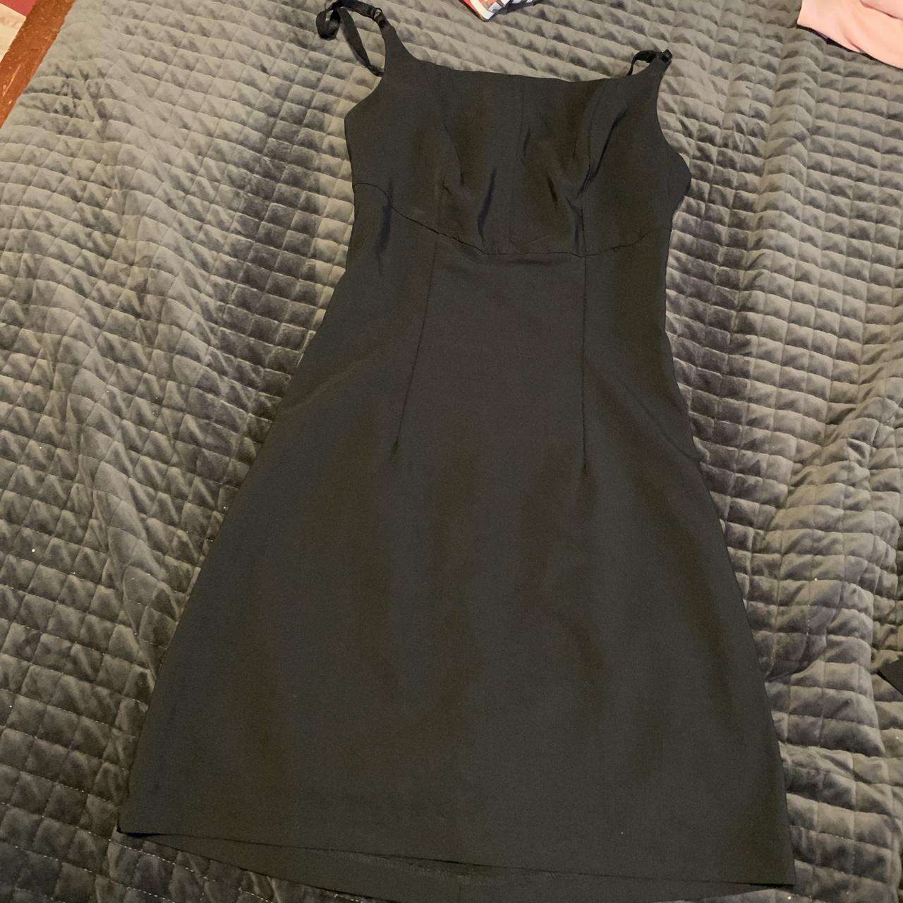 Rocket Candy fitted black dress with open back.... Depop
