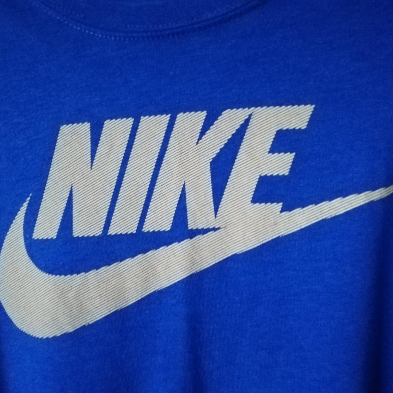 Blue Nike t-shirt in blue with yellow tick and spell... - Depop