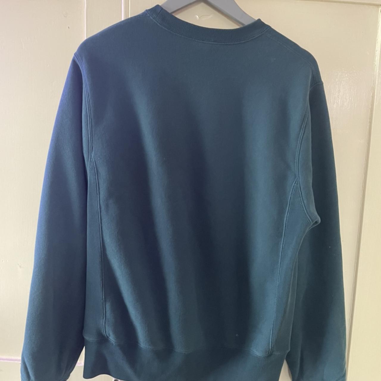 Champion green/blue jumper with a small dark stain... - Depop