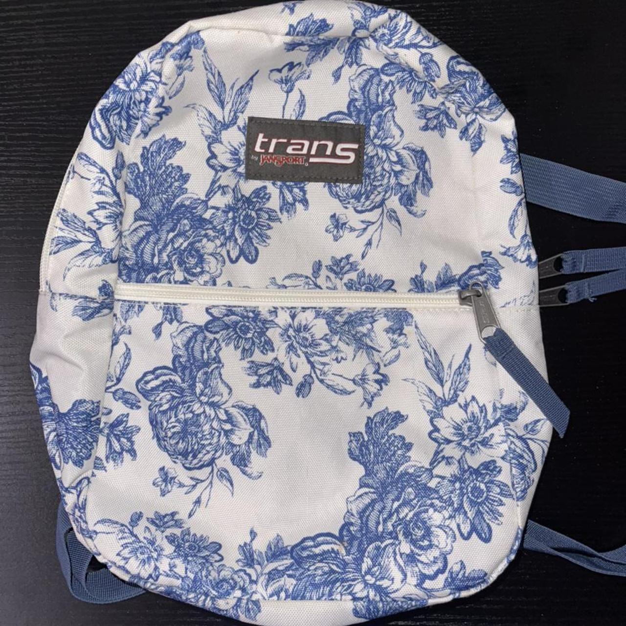 mini trans jansport backpack white with blue flowers... Depop