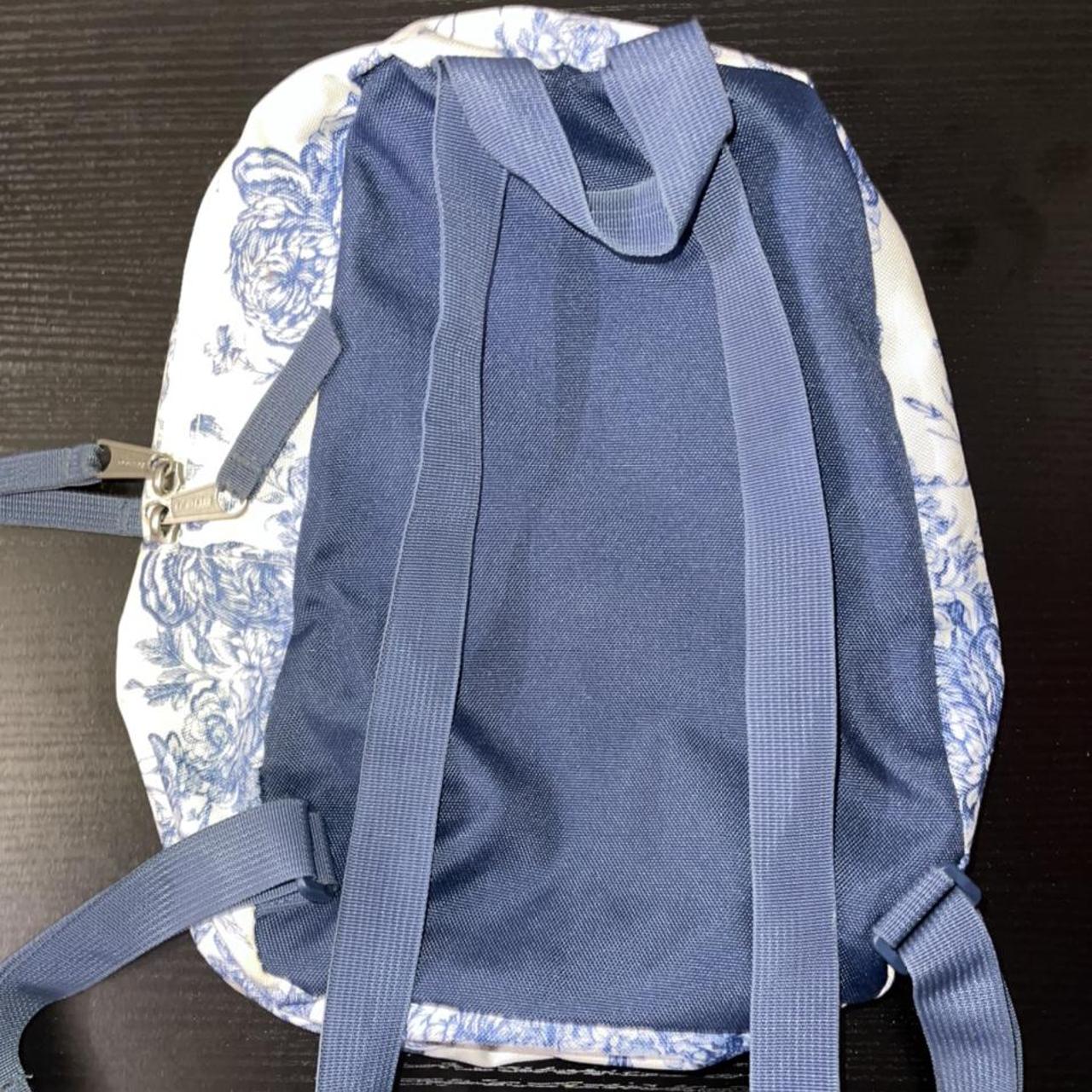 mini trans jansport backpack white with blue flowers... Depop