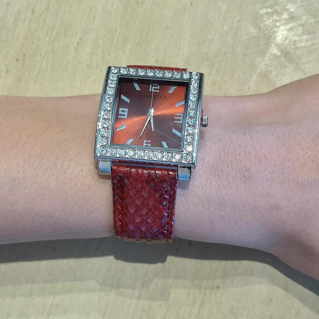 Silver watch red on sale face