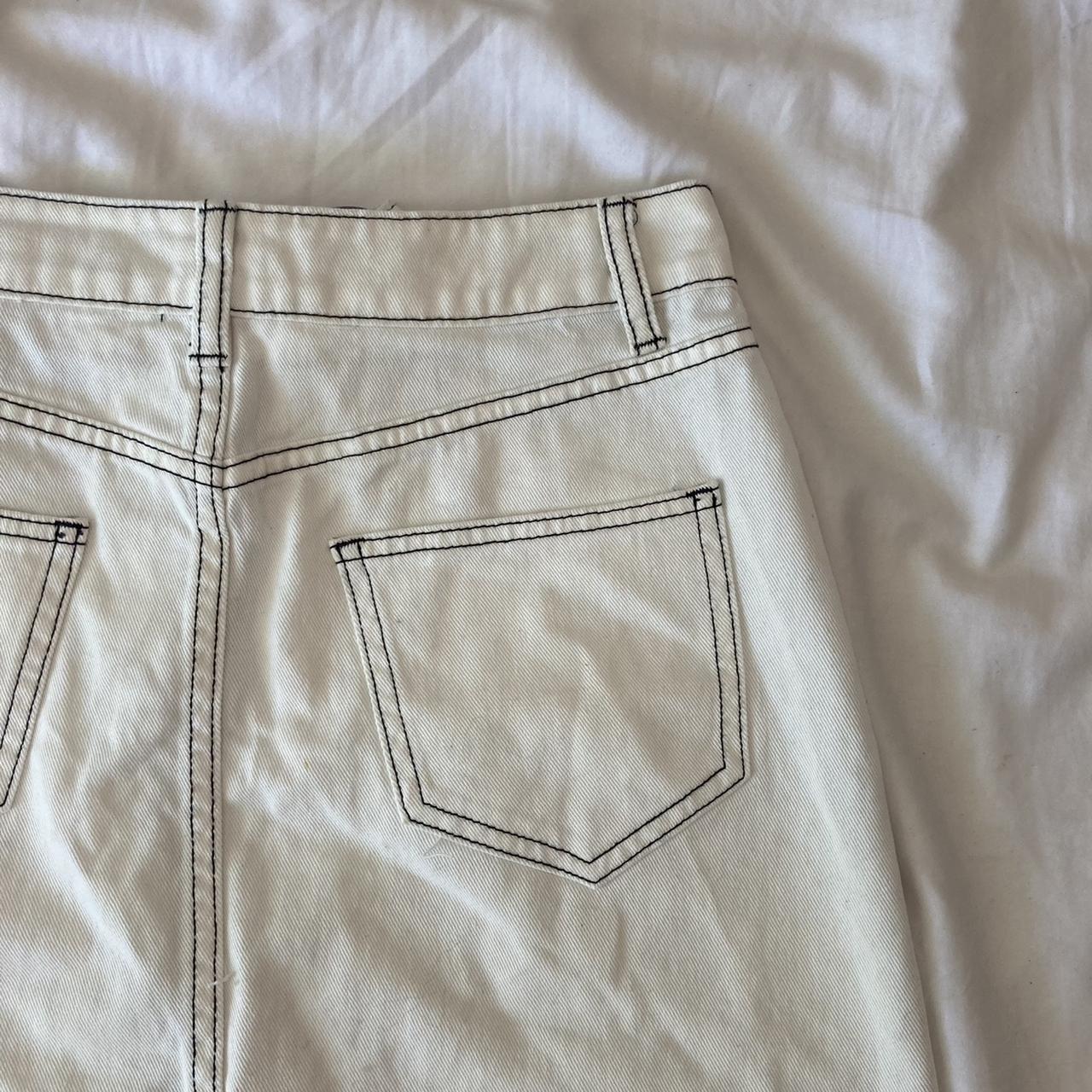 black denim skirt with white contrast stitching... Depop