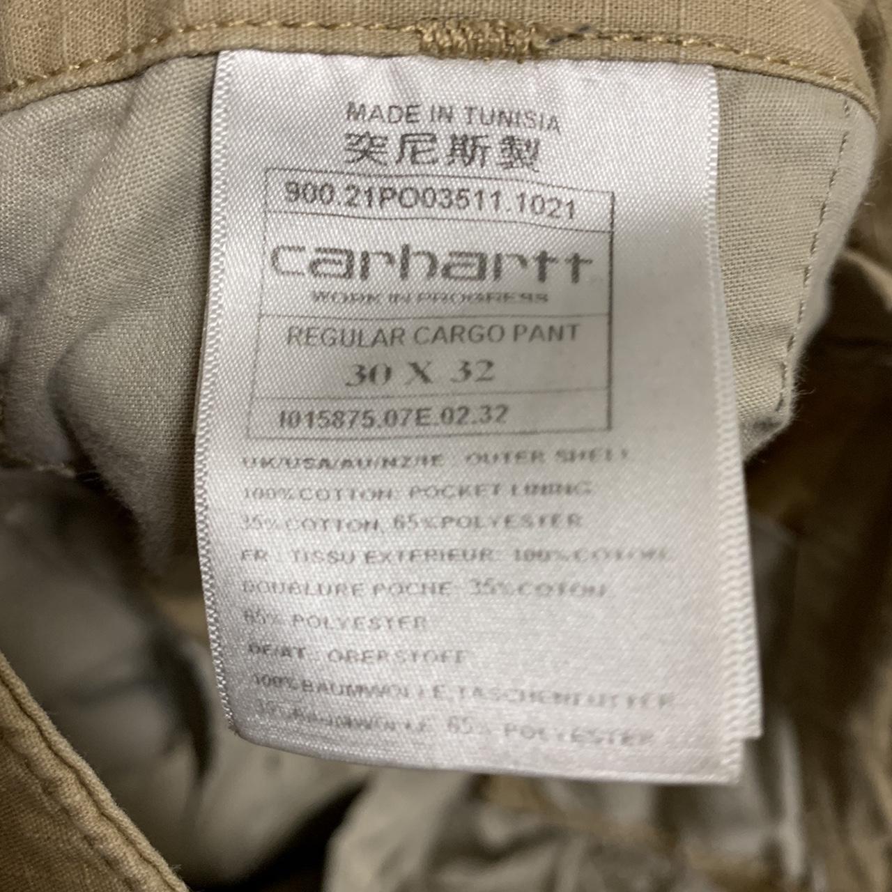 Cream carhatt cargo pants barley worn, selling... - Depop