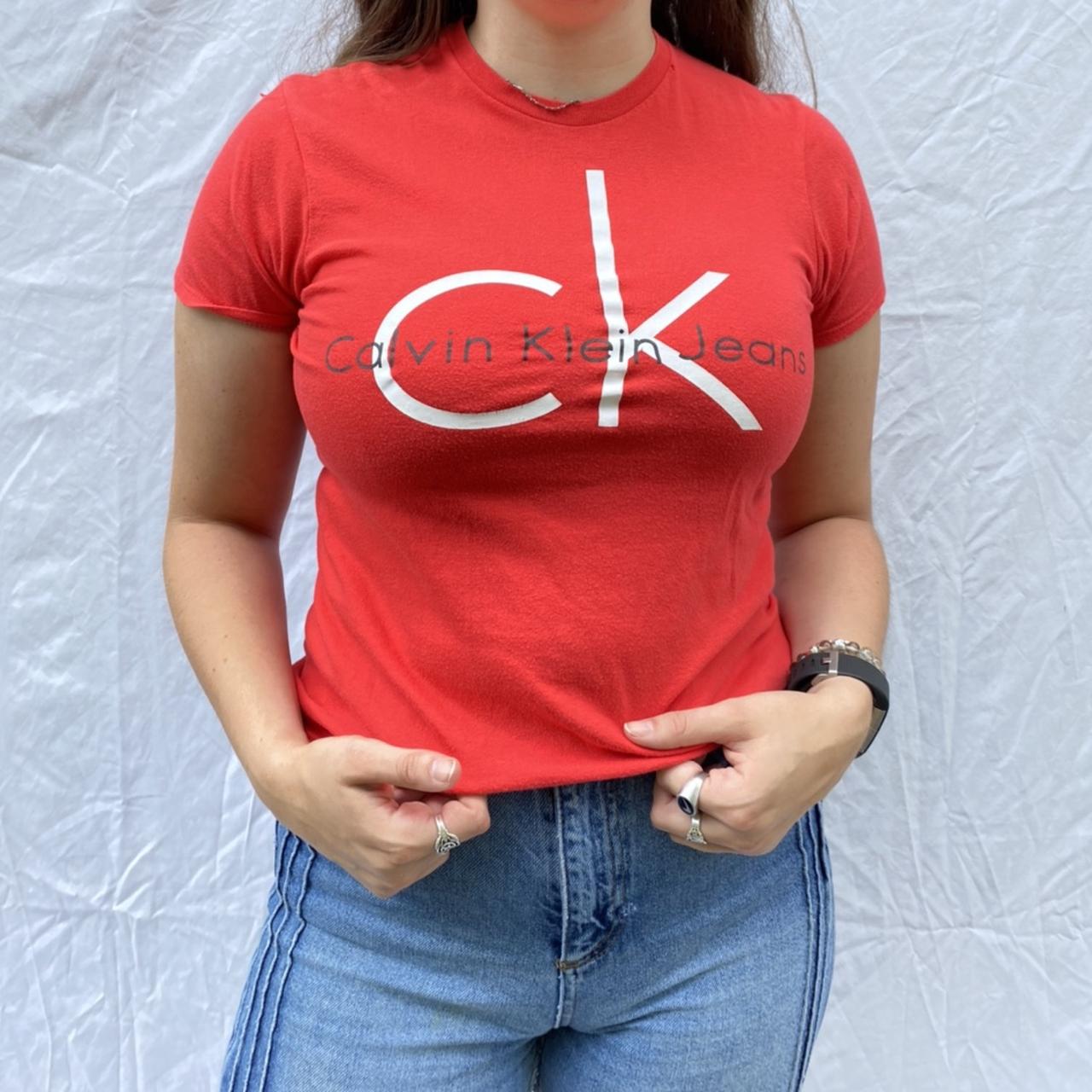 Y2k style red Calvin Klein baby tee graphic tshirt.... Depop