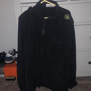 stone island jumper with badge on shoulder