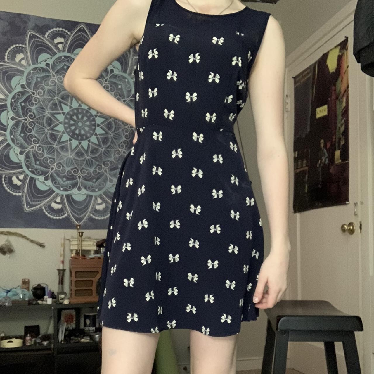 dark blue dress with white bow patterns kept in well... Depop