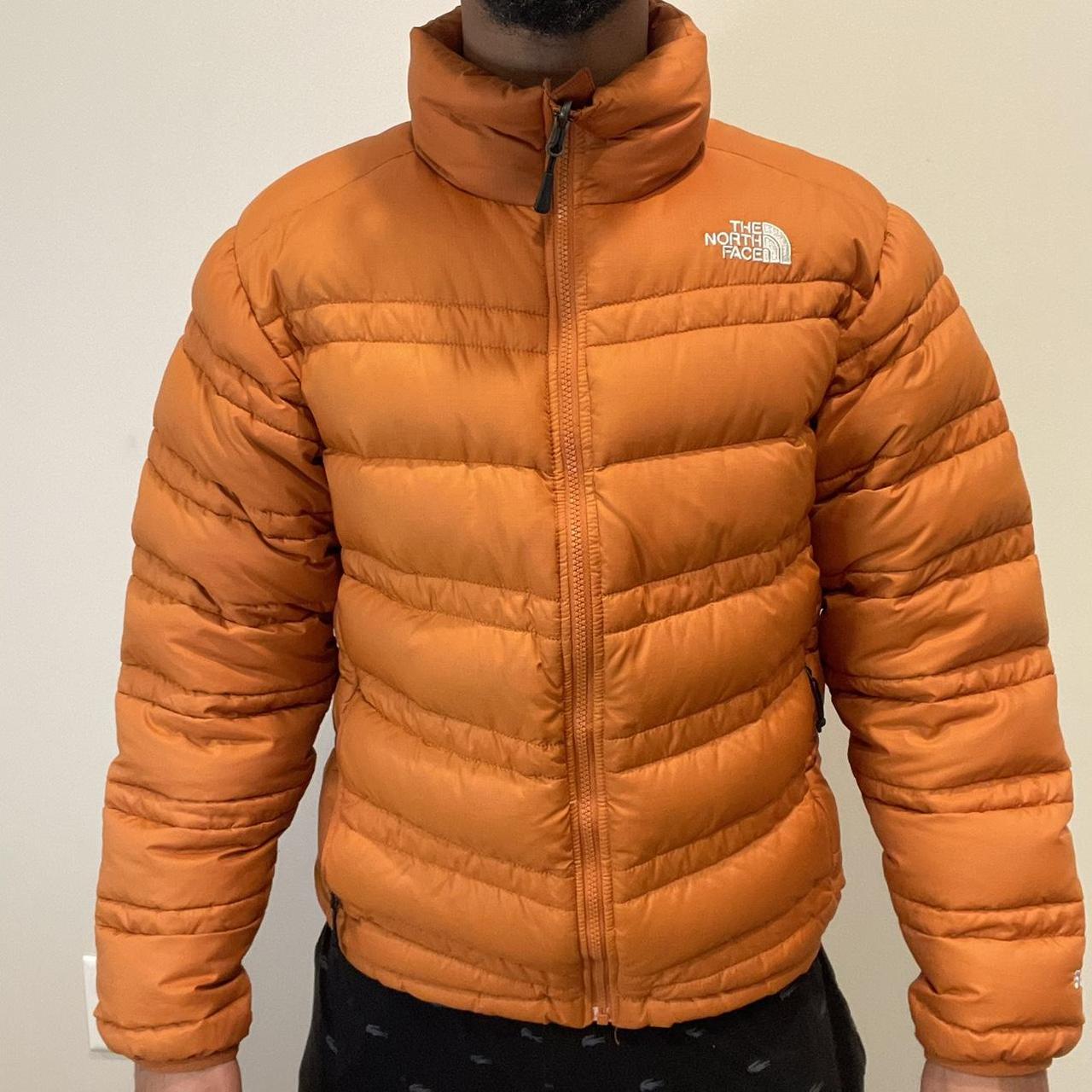 orange north face bubble coat