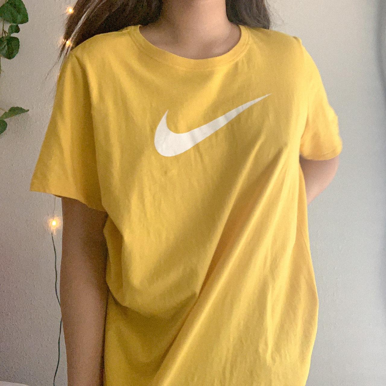 mustard yellow nike shirt