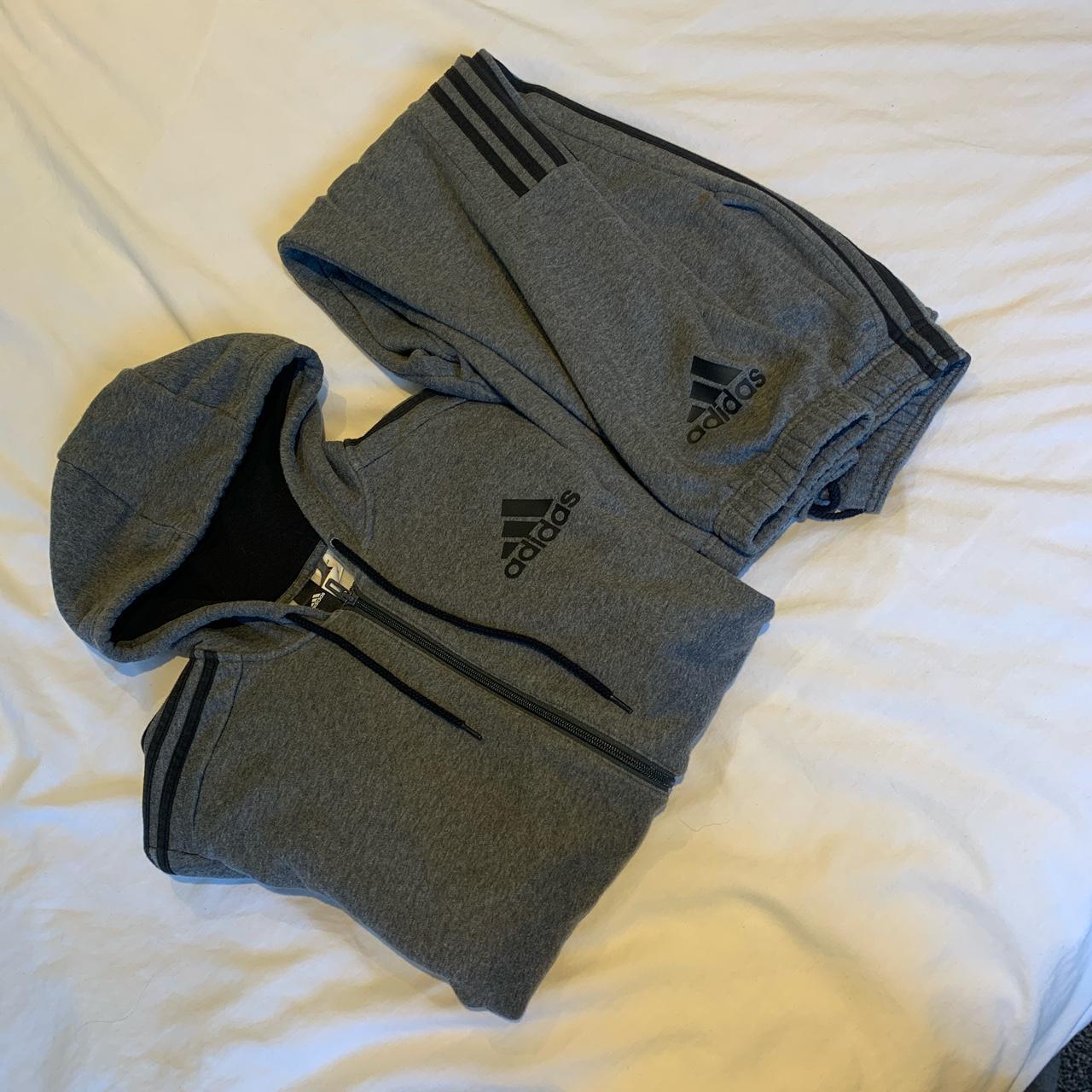 Grey Adidas tracksuit. Hoodie size medium bottoms... - Depop