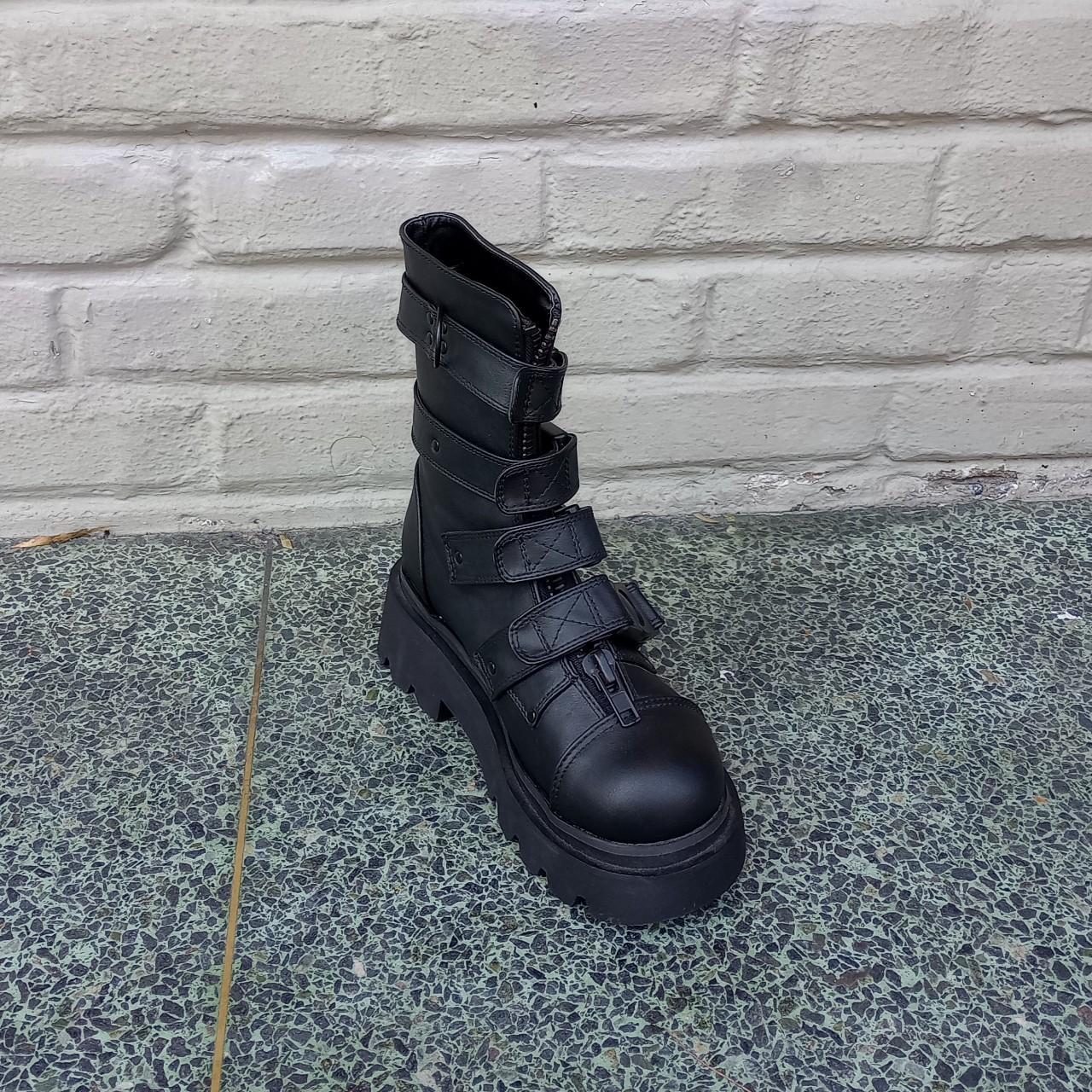 The Demonia Renegade-55 calf-high boot in black has... - Depop