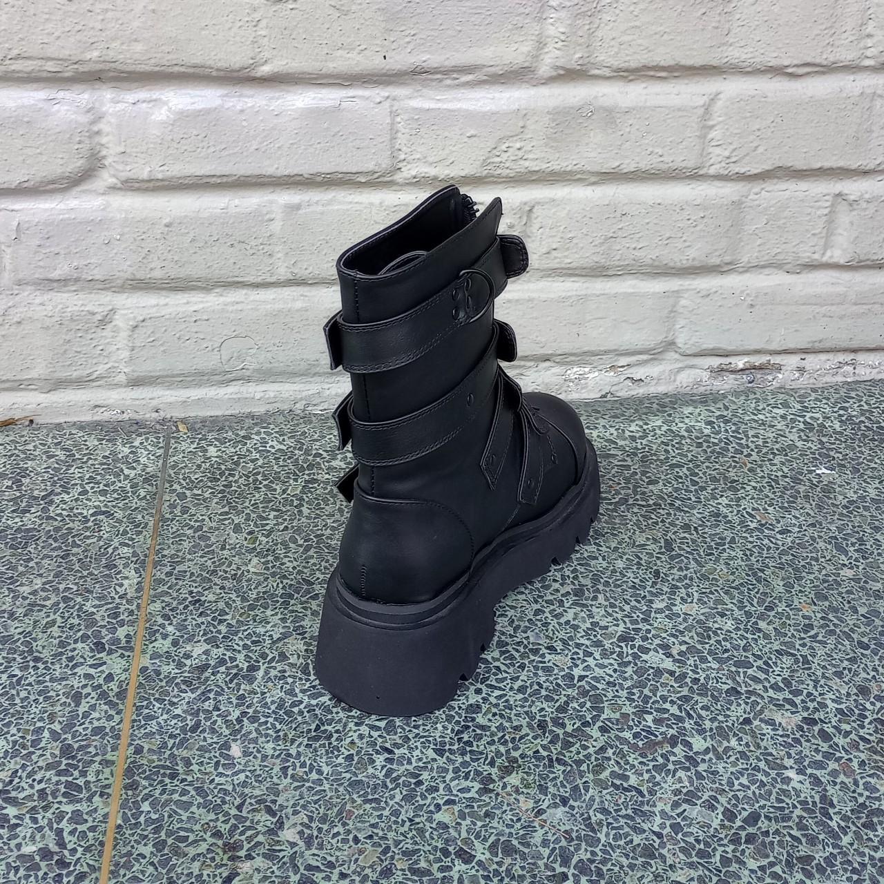 The Demonia Renegade-55 calf-high boot in black has... - Depop