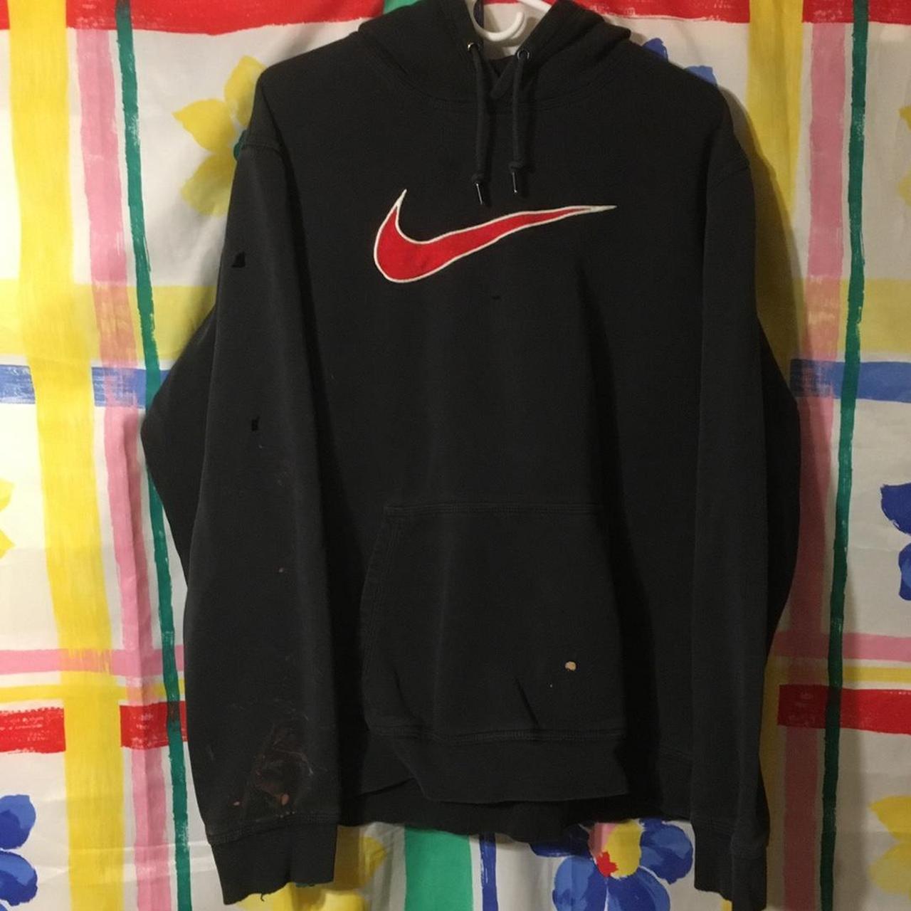 black nike sweatshirt with red swoosh