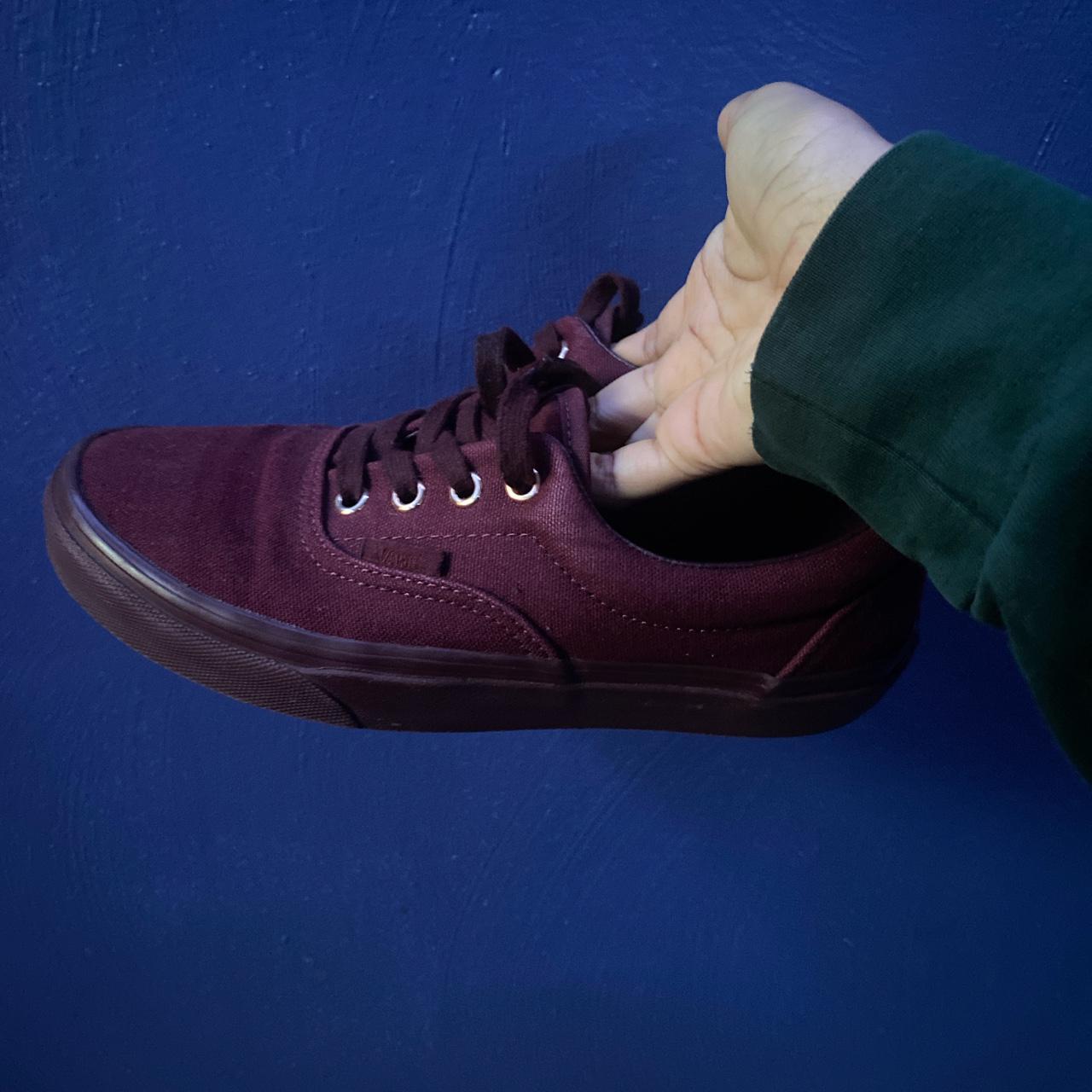 Burgundy woman s Era Vans. Gold eyelets. Size US