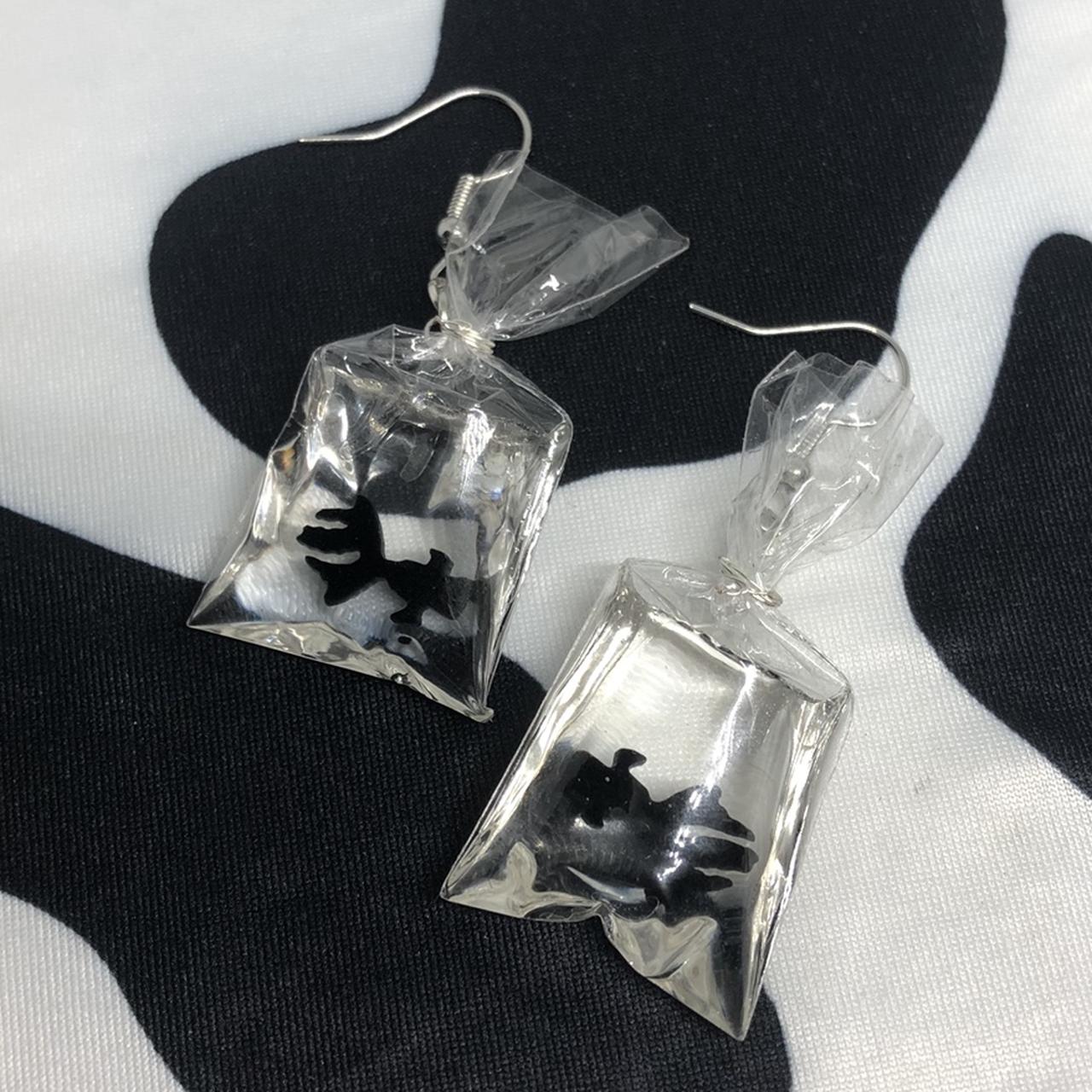 The cutest black moor goldfish bag earrings!... Depop