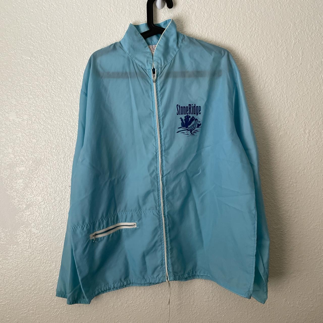 light blue windbreaker