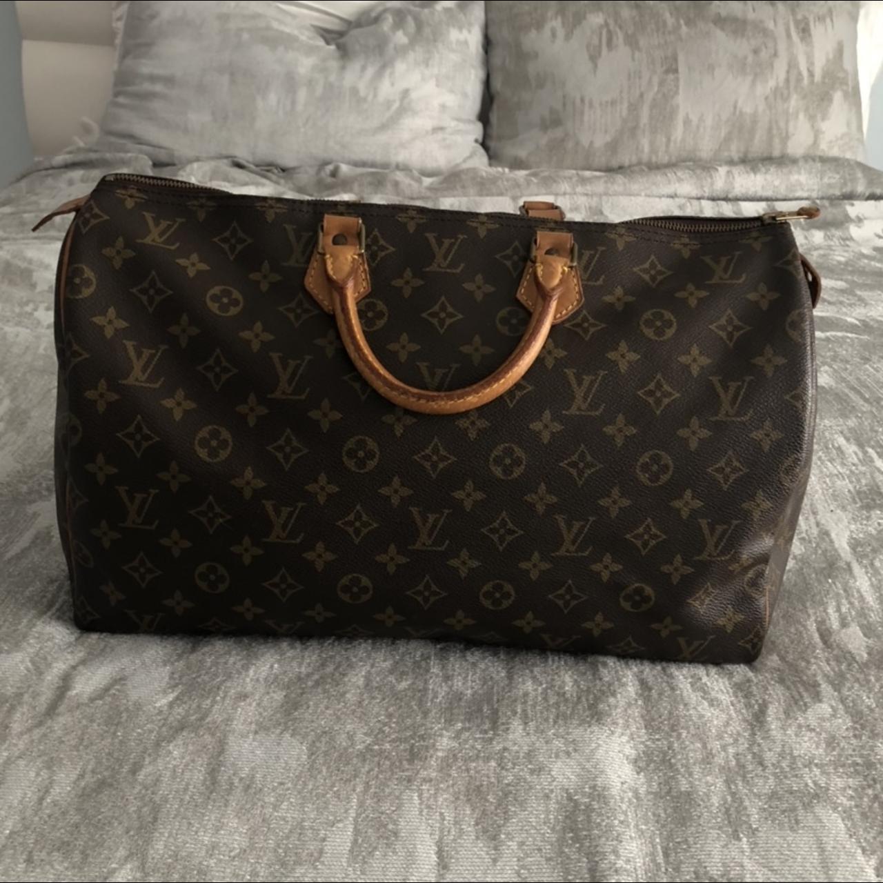 A Louis Vuitton Duffle bag. Used but in very good - Depop