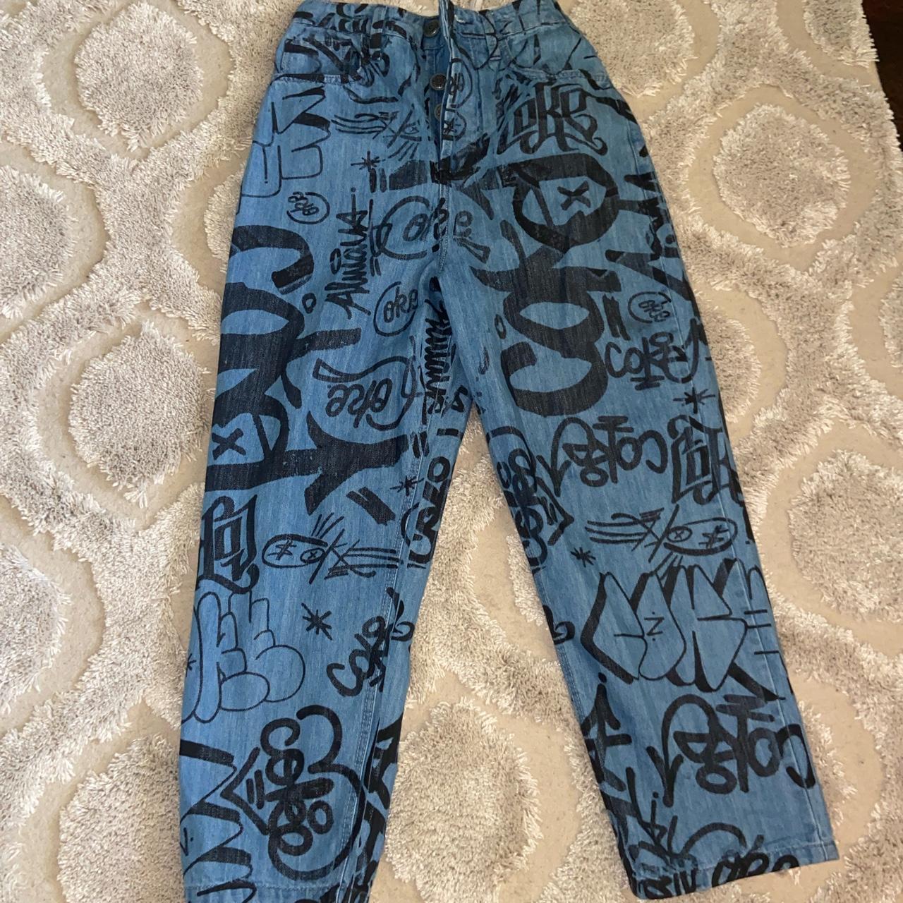 new coca cola graffiti jeans waist is 29” size says... - Depop