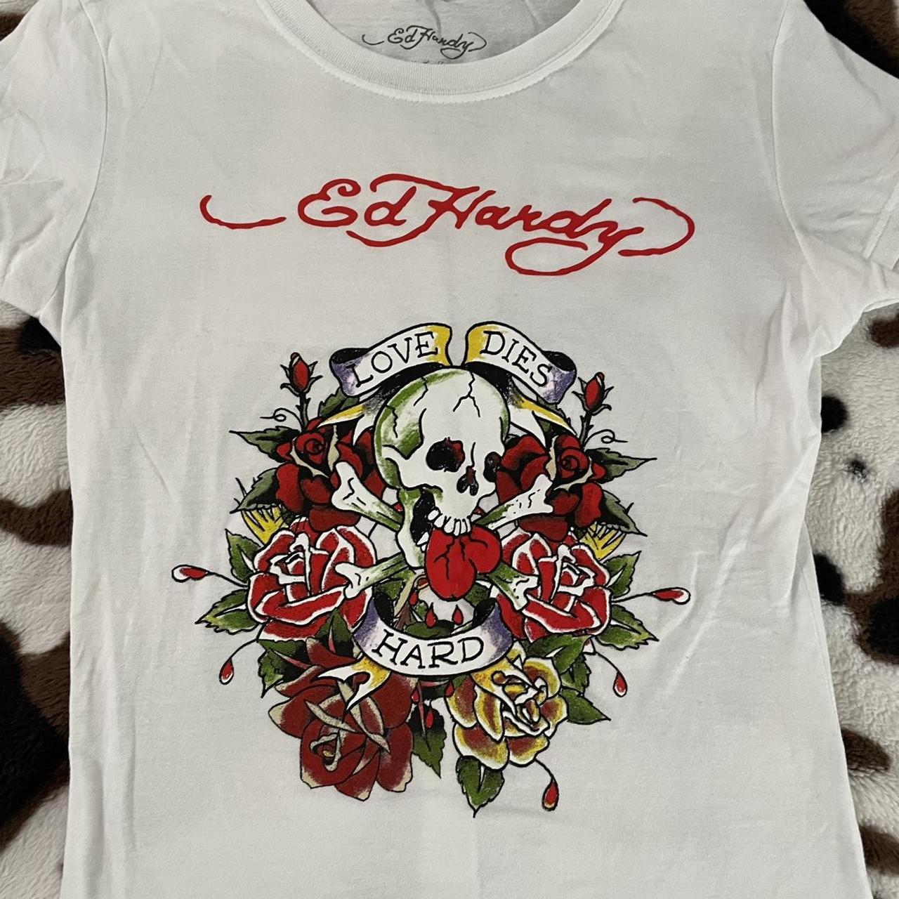 white ed hardy tee marked a size medium but fits... - Depop