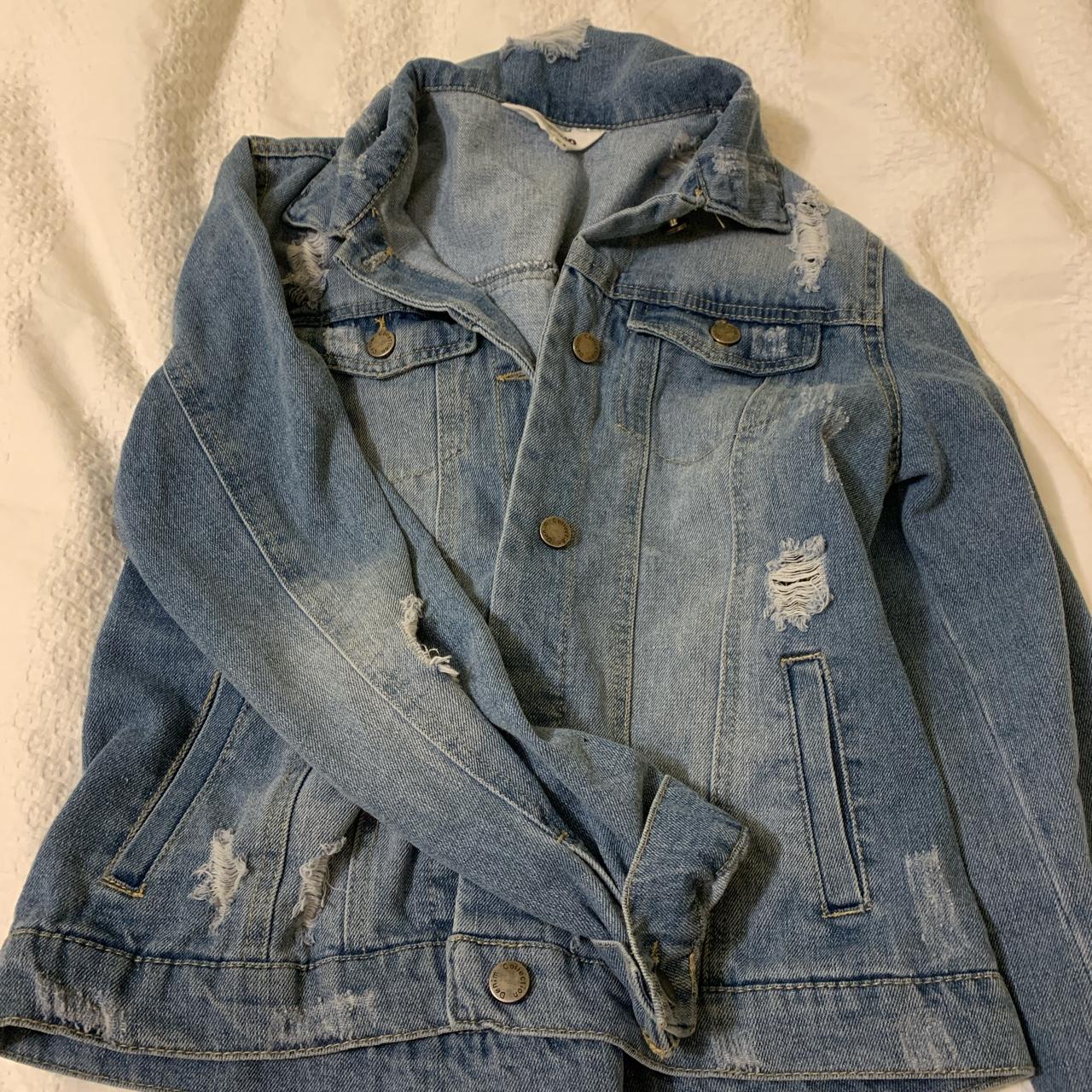 Distressed denim jacket in light wash. Size medium - Depop